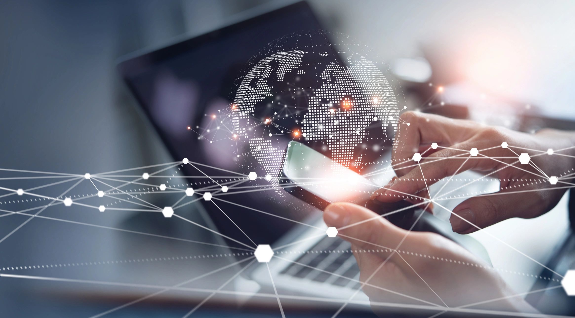 Global connectivity — hands holding a tablet with a network overlay